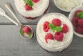 Healthy breakfast, desert, with chia seed pudding, cream, raspberry jam, coconut flakes and fresh berries