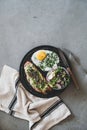 Healthy breakfast with avocado toast, fried egg and salad Royalty Free Stock Photo