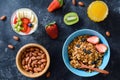 Healthy breakfast food: granola, fruits, nuts, berries and honey Royalty Free Stock Photo