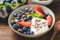 Healthy breakfast food with greek yogurt, crunchy oat granola and fruits