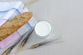 Healthy breakfast, fresh bread and milk, spikelets of wheat, oats, barley