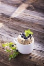 Healthy breakfast. Fresh homemade mug cake with forest blueberries in a white ceramic bowl sprig of ripe berries on Royalty Free Stock Photo