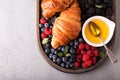 Healthy breakfast with freshly baked croissants and berries Royalty Free Stock Photo