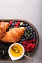 Healthy breakfast with freshly baked croissants and berries Royalty Free Stock Photo