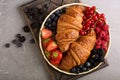 Healthy breakfast with freshly baked croissants and berries Royalty Free Stock Photo