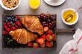 Healthy breakfast with freshly baked croissants and berries Royalty Free Stock Photo