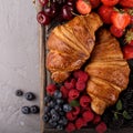 Healthy breakfast with freshly baked croissants and berries Royalty Free Stock Photo