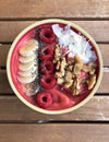 Healthy breakfast, freshly prepared is the Smoothie Bowl. Ingredients are various fruits such as raspberries and banana Royalty Free Stock Photo