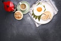 Healthy breakfast. Fried eggs, asparagus, bread and aromatic coffee on a gray background. Free place for text. Soft Royalty Free Stock Photo