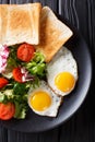 Healthy breakfast of fried eggs with fresh vegetable salad and t Royalty Free Stock Photo