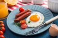 Healthy breakfast with fried eggs, griled sausages, tomato Royalty Free Stock Photo