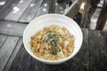 Healthy breakfast fruit bowl with corn flakes and mixed seeds