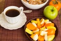 Healthy breakfast with fruit salad, granola and coffee. Royalty Free Stock Photo