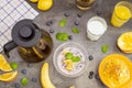 Healthy breakfast with fruits. Black rice pudding, passion fruit, coconut and orange, top view. Tea, milk and orange juice Royalty Free Stock Photo