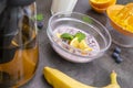 Healthy breakfast with fruits. Black rice pudding, passion fruit, coconut and orange, top view. Tea, milk and orange juice Royalty Free Stock Photo