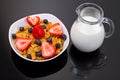 Healthy breakfast with fruity corn flakes and milk Royalty Free Stock Photo