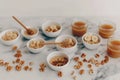 Healthy breakfast with granola, bananas, honey, and nuts on marble table Royalty Free Stock Photo