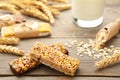 Healthy breakfast with granola bars and milk on grey wooden table Royalty Free Stock Photo