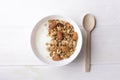 Healthy breakfast granola with greek yogurt, honey, mix nuts on white wooden background top view, copy space Royalty Free Stock Photo