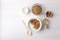 Healthy breakfast granola with greek yogurt, honey, mix nuts on white wooden background top view, copy space Royalty Free Stock Photo