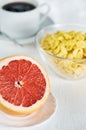 Healthy breakfast with grapefruit and corn flakes Royalty Free Stock Photo