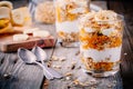 Healthy breakfast. homemade granola with natural yoghurt, banana and caramel sauce Royalty Free Stock Photo