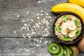 Healthy breakfast. homemade muesli with oat, kiwi fruit, banana, nuts Royalty Free Stock Photo