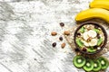 Healthy breakfast. homemade muesli with oat, kiwi fruit, banana and nuts Royalty Free Stock Photo