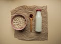 Healthy breakfast ingredients on beige cololred background.