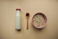 Healthy breakfast ingredients on beige cololred background.