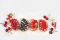 Healthy breakfast with ingredients. Diet fruit mini sandwiches with soft cottage cheese and fresh berries, raspberries, currants