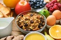 Healthy breakfast ingredients, food frame. Granola, egg, nuts, fruits, berries, toast, milk, yogurt, orange juice Royalty Free Stock Photo