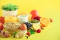 Healthy breakfast ingredients, food frame. Oat and corn flakes, eggs, nuts, fruits, berries, toast, milk, yogurt, orange, banana,