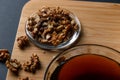 Healthy Breakfast ingredients: honey, walnuts, on a dark background