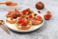 Healthy breakfast with ingredients, toast with figs and soft cream cheese ricotta and honey, canapes or crostini with toasted Royalty Free Stock Photo