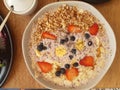 Healthy breakfast made of plain yogurt, fresh fruits, dried fruits and cereals. Royalty Free Stock Photo