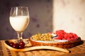 Healthy breakfast with milk and croissants. Fresh tasty berries.