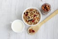 Healthy Breakfast-muesli with berries and nuts in a white plate on a white background. Royalty Free Stock Photo