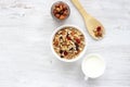 Healthy Breakfast-muesli with berries and nuts in a white plate on a white background. Royalty Free Stock Photo