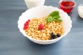 healthy breakfast with muesli and berry Healthy tasty breakfast of muesli with strawberries, raspberries, black currants