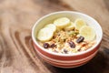 Muesli with cereal, slice banana and milk in a bowl Royalty Free Stock Photo