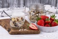 Healthy breakfast with muesli and fresh strawberries and blueberries  milk on a white wooden table in rustic style  close-up Royalty Free Stock Photo