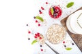 Healthy breakfast: oat flakes in bowls, fresh berries and milk