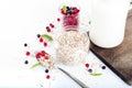 Healthy breakfast: oat flakes in bowls, fresh berries and milk