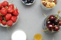 Healthy Breakfast with Oat Flakes, Natural Yogurt, Fresh Blueberries, Strawberries, Almonds and Honey in Glass Bowls. Flat Lay. Co Royalty Free Stock Photo