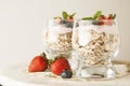 Healthy breakfast, oat meal with fruits: bluebery, strawbery and min, parfait in a glass on a rustic background. Healthy food.