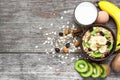 Healthy breakfast. oat muesli with fruits, egg and glass of milk Royalty Free Stock Photo