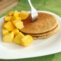 Healthy breakfast oat pancakes with frozen mango