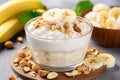 Healthy breakfast with oatmeal, bananas, and yogurt on sunlit morning table in cozy ambiance Royalty Free Stock Photo