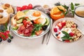 Healthy breakfast with oatmeal, berries, egg, bacon and a cup of coffee. Good morning Royalty Free Stock Photo
